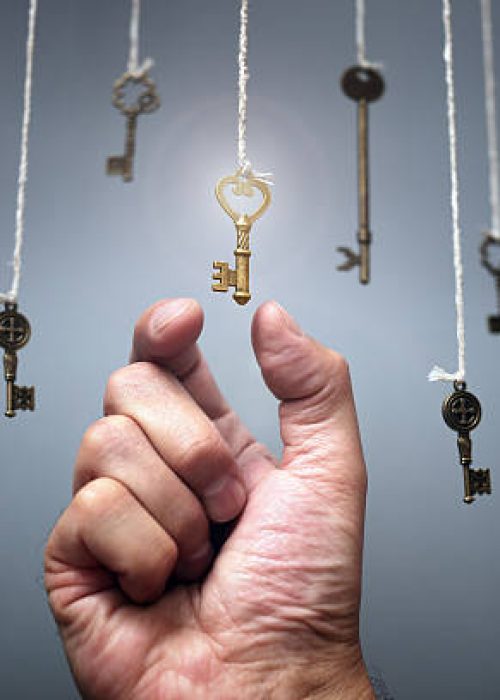 Choosing the key to success from hanging keys concept for aspirations, achievement and incentive